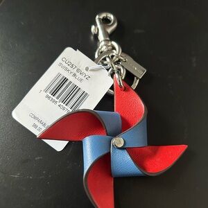 NWT COACH PIN WHEEL BAG CHARM FOB BLUE/RED LEATHER CU257
